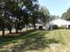 Ranch home with carport, nestled in a tree-lined neighborhood at 7118 Quail Meadow Ln, Charlotte, NC 28210