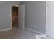Bedroom with door to private exterior access at 7118 Quail Meadow Ln, Charlotte, NC 28210