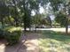 Landscaped walkway leading through a tree-lined community at 7118 Quail Meadow Ln, Charlotte, NC 28210
