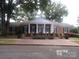 Brick building with columns and a grand entrance at 7118 Quail Meadow Ln, Charlotte, NC 28210