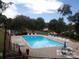 Inviting community pool with plenty of lounge chairs at 7118 Quail Meadow Ln, Charlotte, NC 28210