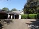 Attached carport with parking for two cars at 7118 Quail Meadow Ln, Charlotte, NC 28210