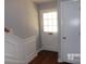 Inviting entryway with hardwood floors, a coat closet, and staircase at 7118 Quail Meadow Ln, Charlotte, NC 28210