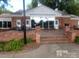 Building with large windows and brick patio at 7118 Quail Meadow Ln, Charlotte, NC 28210