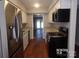 Modern kitchen with stainless steel appliances and granite countertops at 7118 Quail Meadow Ln, Charlotte, NC 28210