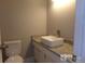 Updated bathroom with granite countertop and vessel sink at 7118 Quail Meadow Ln, Charlotte, NC 28210
