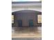 Covered carport with space for two vehicles and trash receptacles at 7118 Quail Meadow Ln, Charlotte, NC 28210