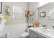 Elegant powder room with gray vanity and decorative accents at 1229 Brecken Ct, Kannapolis, NC 28081