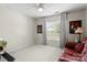 Bedroom with window, couch, and ceiling fan at 1229 Brecken Ct, Kannapolis, NC 28081