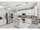 Modern kitchen with stainless steel appliances and granite countertops at 1229 Brecken Ct, Kannapolis, NC 28081