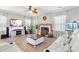 Bright living room with fireplace, hardwood floors, and comfortable seating at 1229 Brecken Ct, Kannapolis, NC 28081
