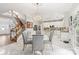 Kitchen features white cabinets, marble floor, and a breakfast bar at 1229 Brecken Ct, Kannapolis, NC 28081