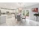 Modern kitchen with white cabinets, granite countertops, and a kitchen island at 1229 Brecken Ct, Kannapolis, NC 28081