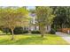 Two-story home with brick facade and lush landscaping at 1229 Brecken Ct, Kannapolis, NC 28081