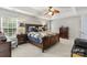 Large bedroom with wood bed frame and ceiling fan at 1229 Brecken Ct, Kannapolis, NC 28081