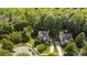 Aerial view of house and surrounding neighborhood, showing driveway and trees at 1229 Brecken Ct, Kannapolis, NC 28081