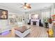 Open living room with hardwood floors, fireplace, and view into the kitchen at 1229 Brecken Ct, Kannapolis, NC 28081