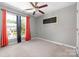 Bedroom with ceiling fan and orange curtains at 12136 Cane Branch Way, Huntersville, NC 28078