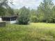 Mobile home with a screened porch and yard at 6134 Shirley Rd, Fort Lawn, SC 29714