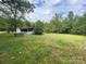 Mobile home on a grassy lot near woods at 6134 Shirley Rd, Fort Lawn, SC 29714