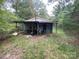 Rustic cabin nestled in the woods, offering a secluded feel at 6134 Shirley Rd, Fort Lawn, SC 29714