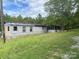 Mobile home with a screened porch and yard at 6134 Shirley Rd, Fort Lawn, SC 29714
