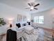 Bright living room with hardwood floors, comfortable seating, and large windows at 1136 Forest Dr, Marshville, NC 28103