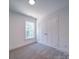 Bright bedroom with double doors and a window offering natural light at 1136 Forest Dr, Marshville, NC 28103