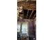 Room shows significant damage to walls and ceiling; needs major repairs at 215 S Ervin Ave, Newton, NC 28658
