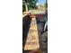 Damaged wooden porch floor shows fire damage; needs replacement at 215 S Ervin Ave, Newton, NC 28658