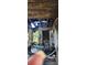 Extensive fire damage is visible throughout the front porch area at 215 S Ervin Ave, Newton, NC 28658