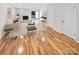 Living room with stone fireplace and hardwood floors at 1527 South Point Rd, Belmont, NC 28012