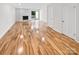 Living room with stone fireplace and hardwood floors at 1527 South Point Rd, Belmont, NC 28012