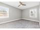 Bright bedroom with neutral walls and carpet at 5428 Alpine Ln, Charlotte, NC 28269