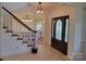 Elegant entryway with hardwood floors, a staircase, and a beautiful door at 7550 Barrier Georgeville Rd, Concord, NC 28025