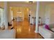 Open living room showcasing hardwood floors and a view into the dining area at 7550 Barrier Georgeville Rd, Concord, NC 28025