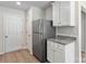 Modern kitchen with white cabinets and granite countertops at 146 Adams Tree Way, Troutman, NC 28166
