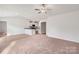Open living space with hardwood floors and kitchen island at 146 Adams Tree Way, Troutman, NC 28166