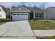 Newly constructed craftsman style home with a two-car garage and freshly seeded lawn at 217 Colonial Reserve Ave, Troutman, NC 28166