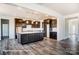 Modern kitchen with a large island and dark wood cabinets at 3229 Mcharney Dr # 30, Harrisburg, NC 28075