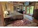 Large bedroom with a king-size bed, and access to a deck at 8693 Gilead Rd, Huntersville, NC 28078