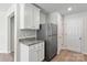 Modern kitchen with white cabinets and granite countertops at 217 Colonial Reserve Ave, Troutman, NC 28166