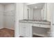 Bathroom with granite countertop, white cabinets and a shower/tub combo at 217 Colonial Reserve Ave, Troutman, NC 28166