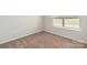 Bright bedroom featuring a large window and neutral colored carpet at 217 Colonial Reserve Ave, Troutman, NC 28166