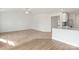 Spacious living room with carpeted floor and kitchen views at 217 Colonial Reserve Ave, Troutman, NC 28166