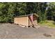 Tan colored storage shed with American flag at 746 Springwood Dr # 14&15, Mount Gilead, NC 27306