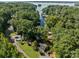 Aerial view of house on wooded lot, near the water at 746 Springwood Dr # 14&15, Mount Gilead, NC 27306