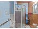 Bathroom with shower and wood-paneled walls at 746 Springwood Dr # 14&15, Mount Gilead, NC 27306
