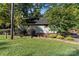 Landscaped yard with home and deck at 746 Springwood Dr # 14&15, Mount Gilead, NC 27306