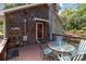 Deck with table and chairs, wooded view at 746 Springwood Dr # 14&15, Mount Gilead, NC 27306